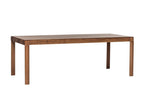 Seitliche Ansicht des BURLY Esstisches aus Massivholz Nussbaum, betont das minimalistische Design und die stabilen Tischbeine