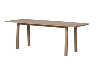 Ein NERVOSA Esstisch mit vier Beinen und einer rechteckigen Tischplatte.
