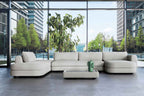 TRIBECA Designer Modular Sofa von Volumen mit zwei Chaiselongues und passendem Ablagetisch im modernen Loungebereich