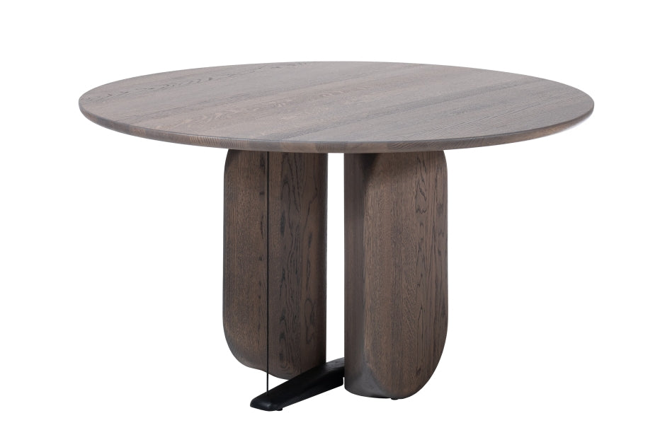 Ein runder Esstisch aus dunkelbraunem Holz mit einer schwarzen Metallstütze am Boden.