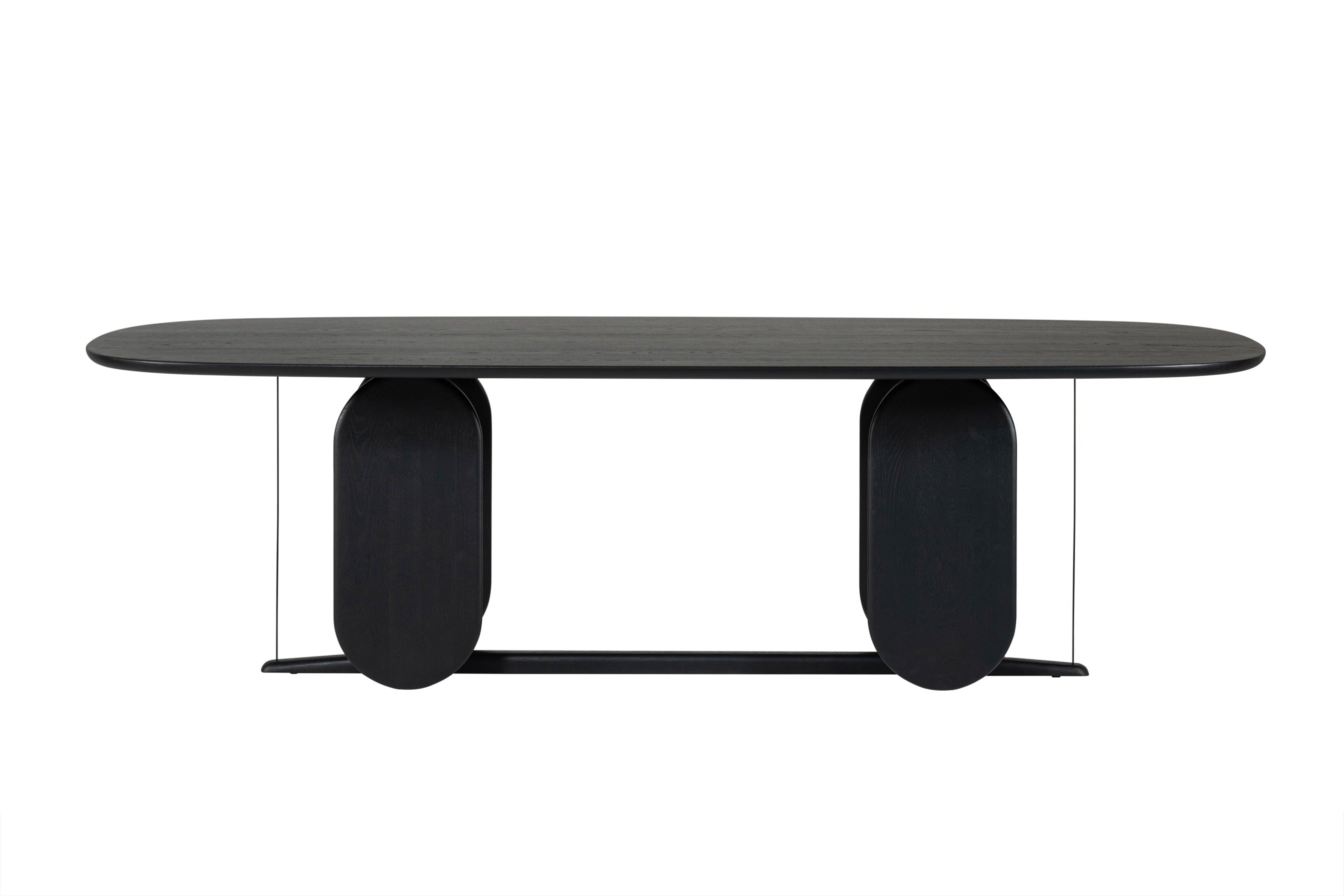Frontansicht des WHERRY Designer Esstisches von Woak in schwarzem Holz mit markanten ovalen Tischbeinen